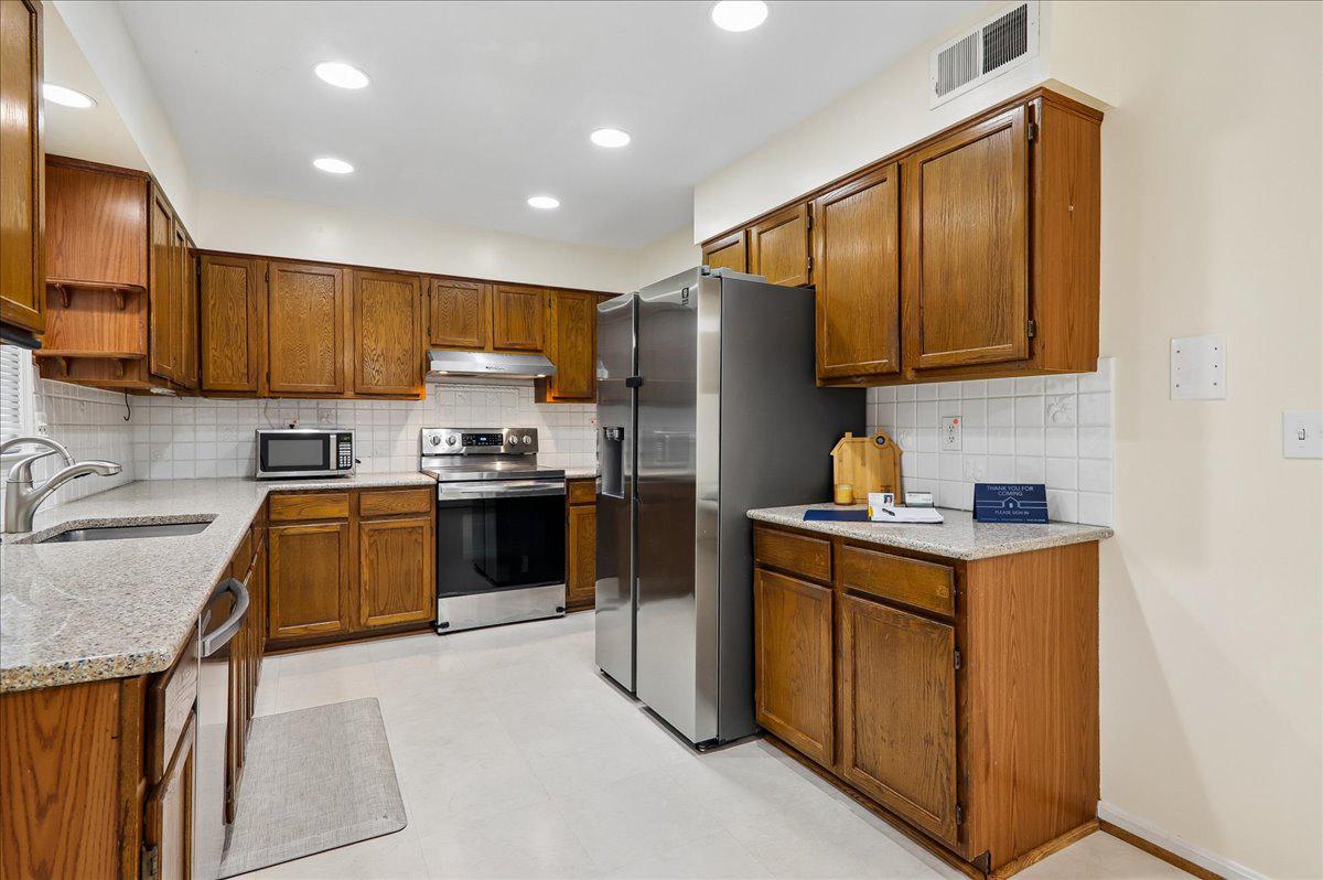7408 Spring Tree Drive Springfield, VA 22153 - Photo 3 of 48 Kitchen with warm wood tones.