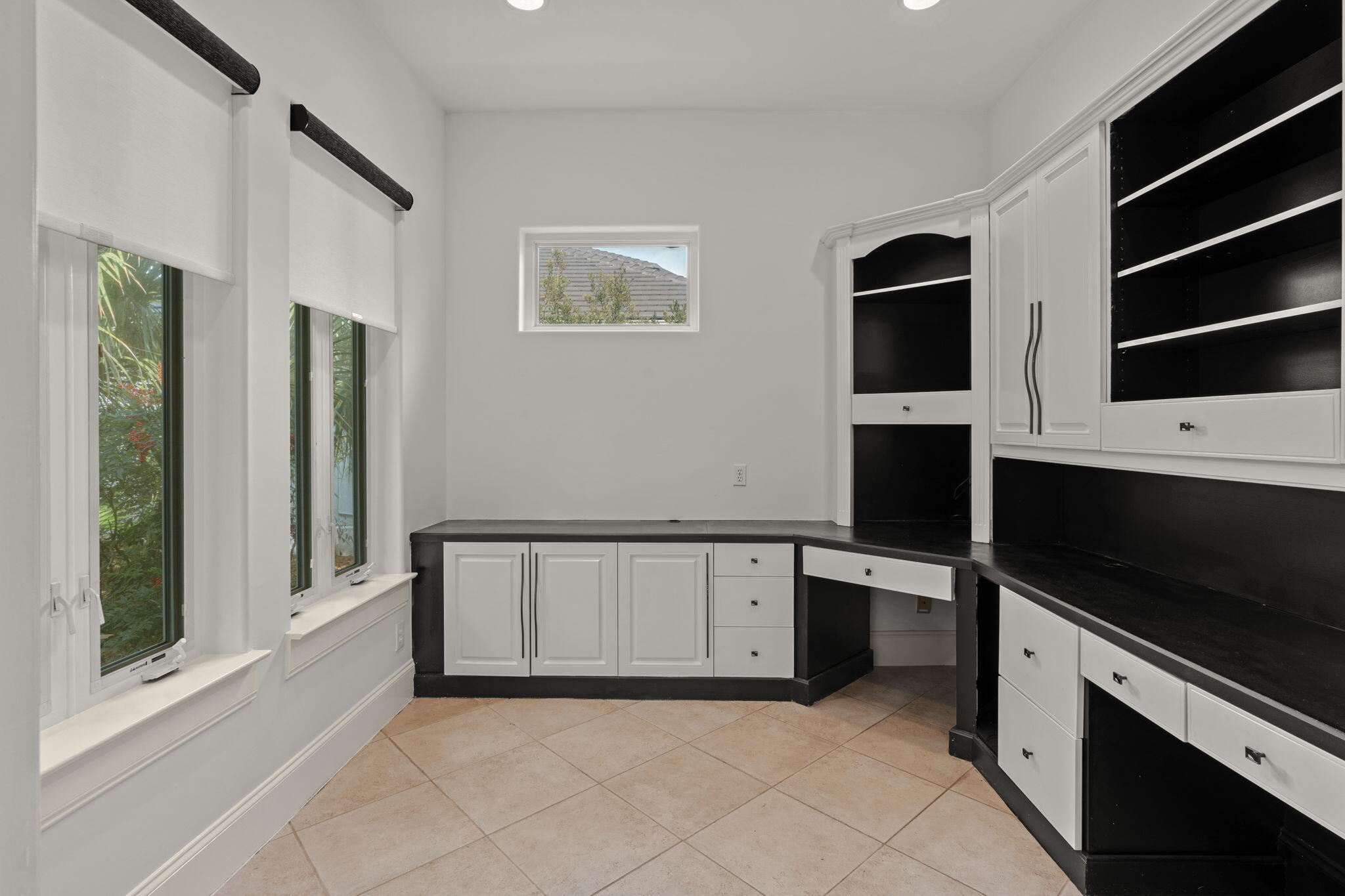 3028 Club Drive Miramar Beach, FL 32550 - Photo 11 of 40 a view of an empty room with a fireplace and a window