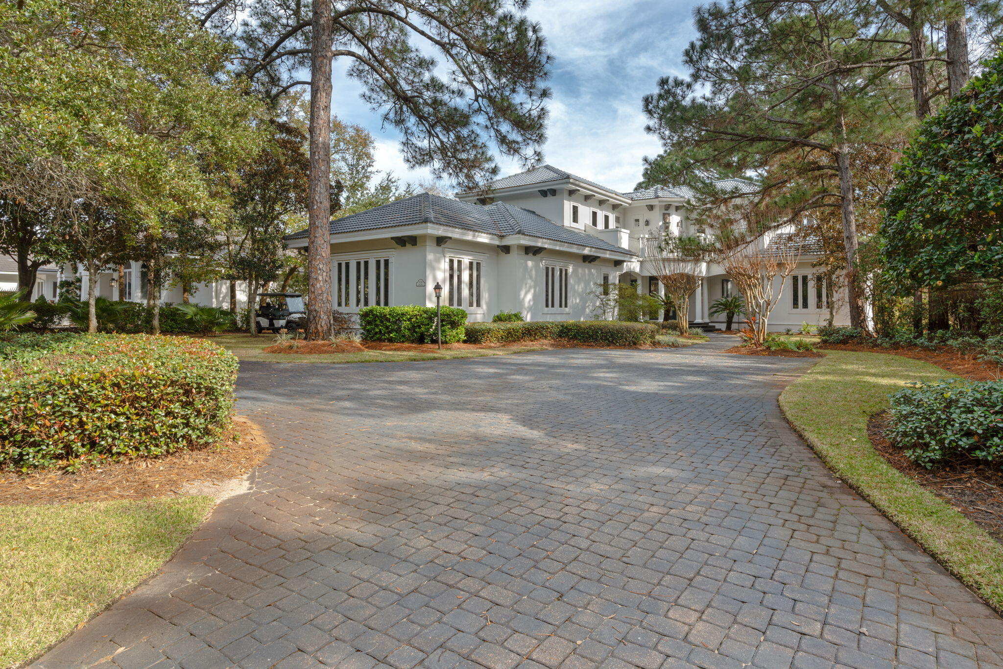 3028 Club Drive Miramar Beach, FL 32550 - Photo 2 of 40 a front view of a building with trees