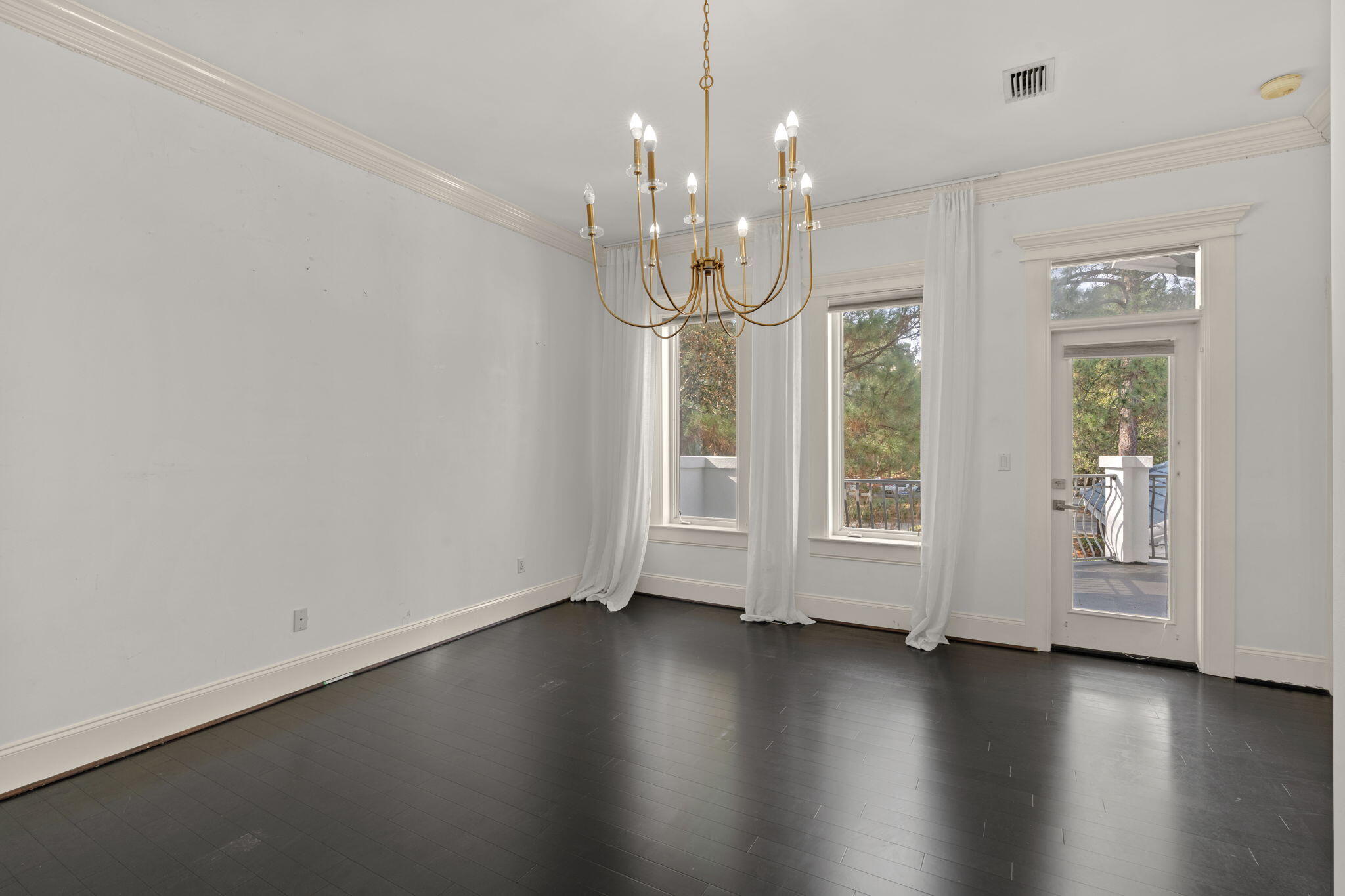 3028 Club Drive Miramar Beach, FL 32550 - Photo 22 of 40 an empty room with wooden floor and windows