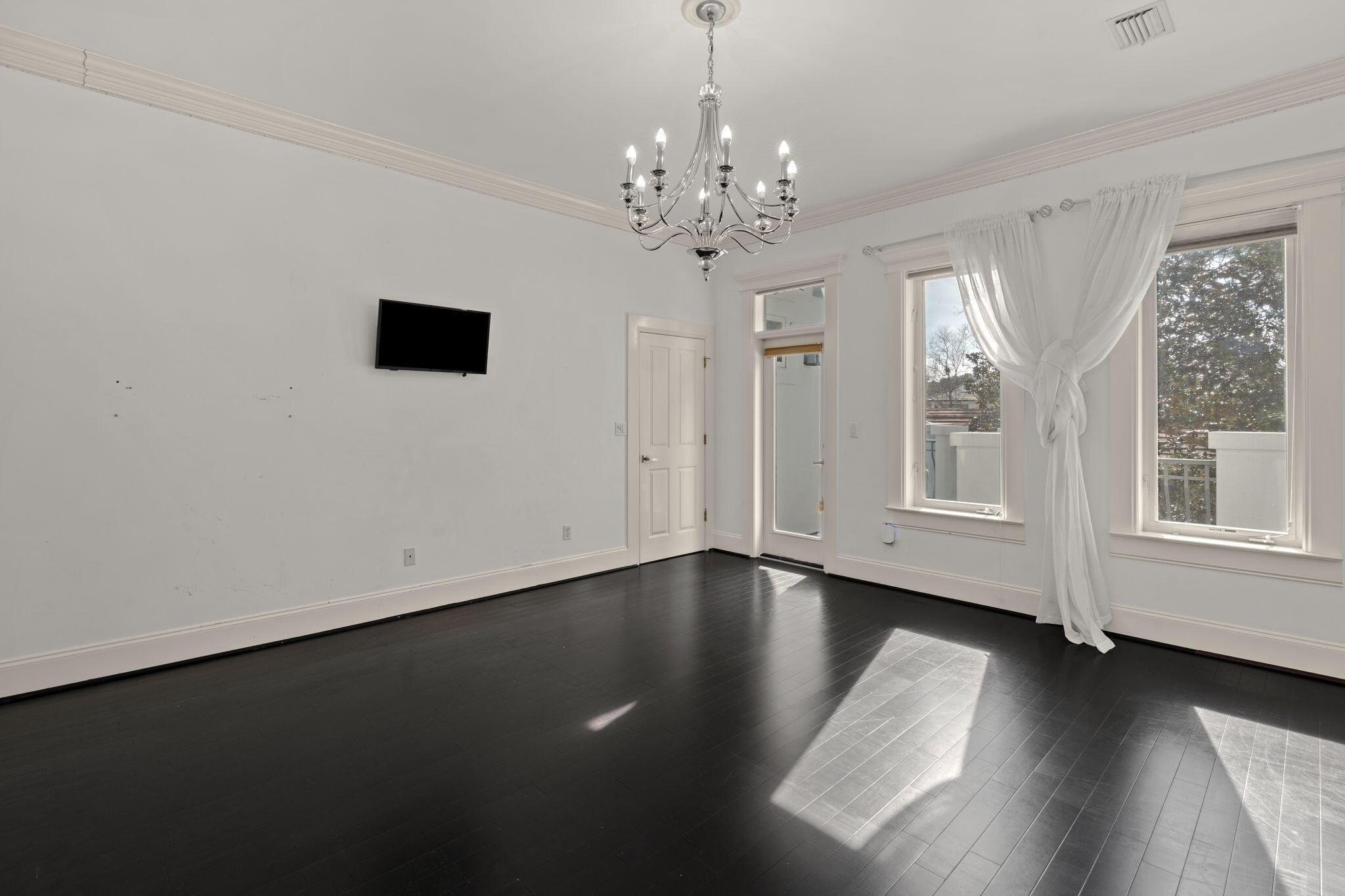 3028 Club Drive Miramar Beach, FL 32550 - Photo 24 of 40 a view of an empty room with wooden floor and a window