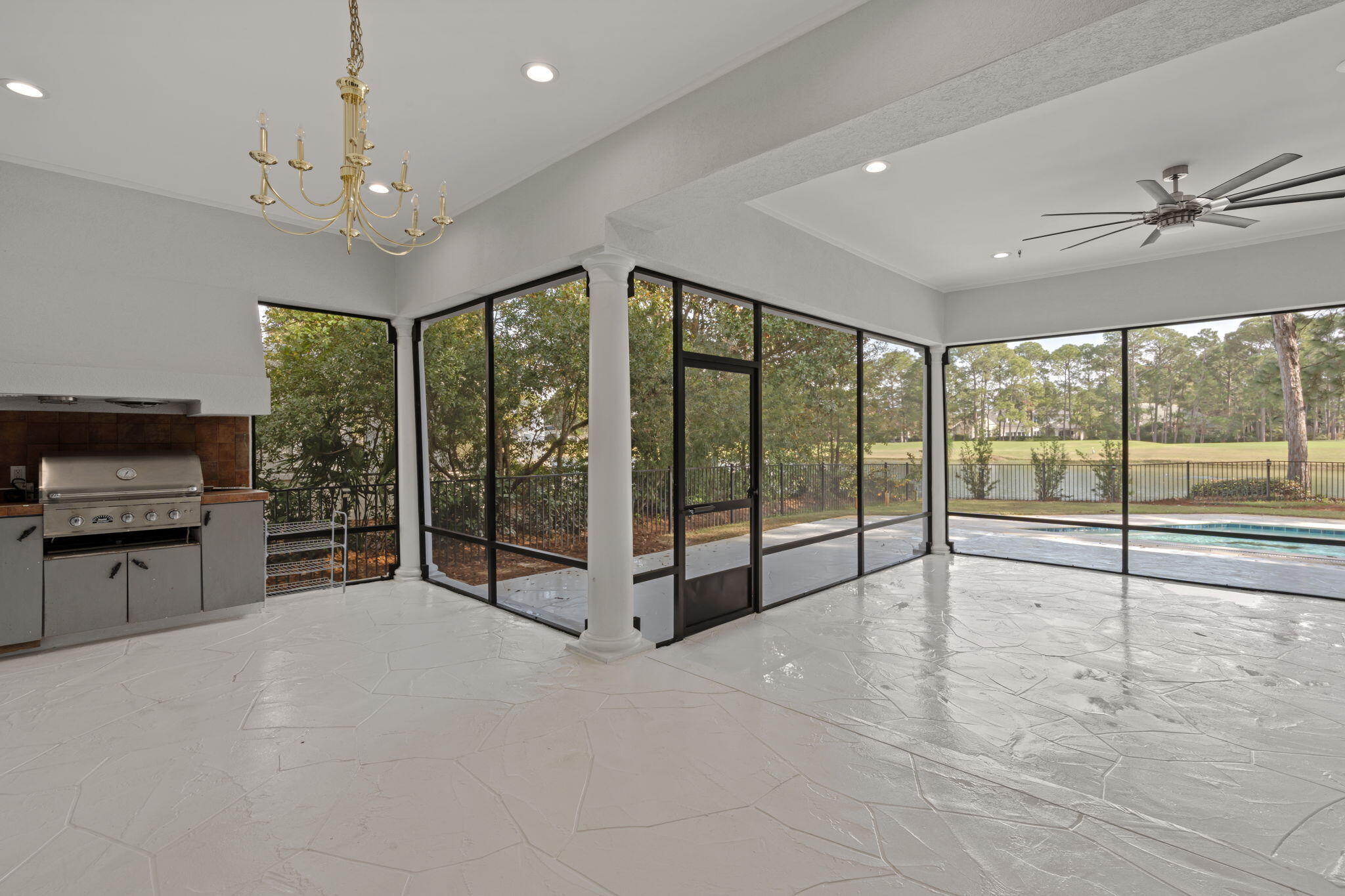 3028 Club Drive Miramar Beach, FL 32550 - Photo 28 of 40 a view of a kitchen with a large window and stainless steel appliances