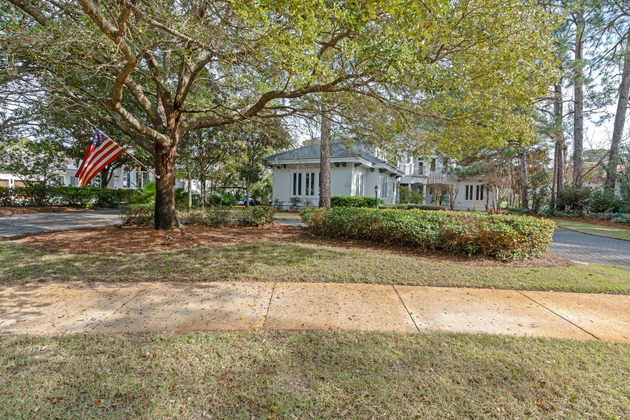 3028 Club Drive Miramar Beach, FL 32550 - Photo 38 of 40 a front view of a house with a yard and trees