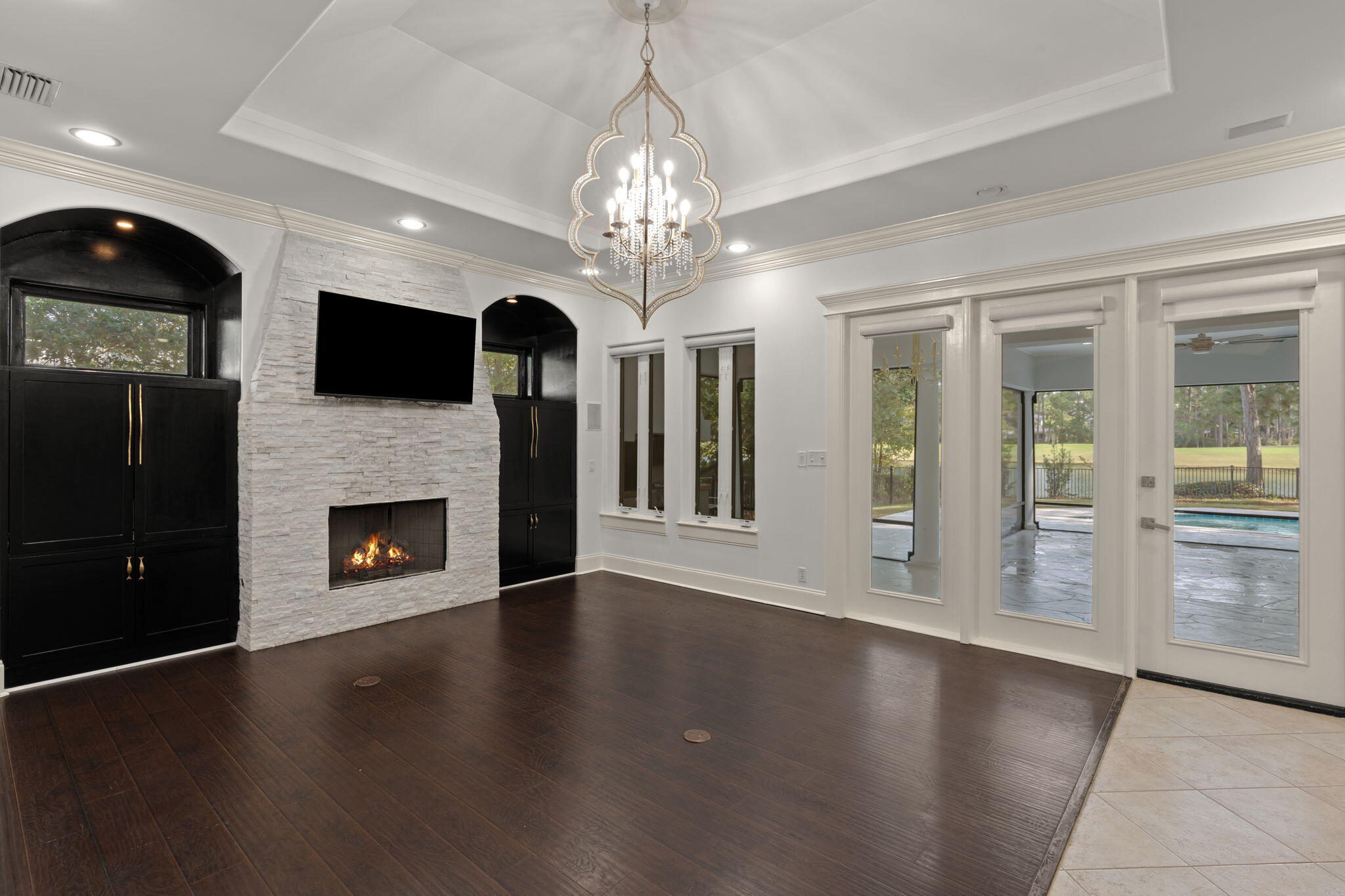 3028 Club Drive Miramar Beach, FL 32550 - Photo 5 of 40 a view of a livingroom with a fireplace wooden floor and window