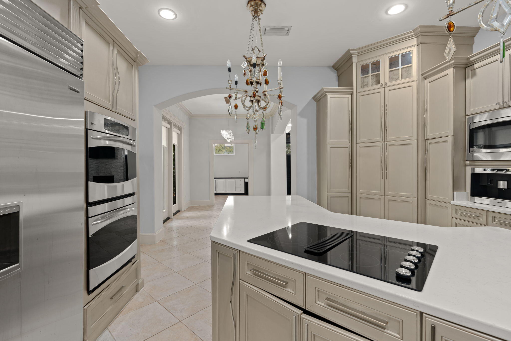 3028 Club Drive Miramar Beach, FL 32550 - Photo 9 of 40 a kitchen with stainless steel appliances a refrigerator sink and microwave
