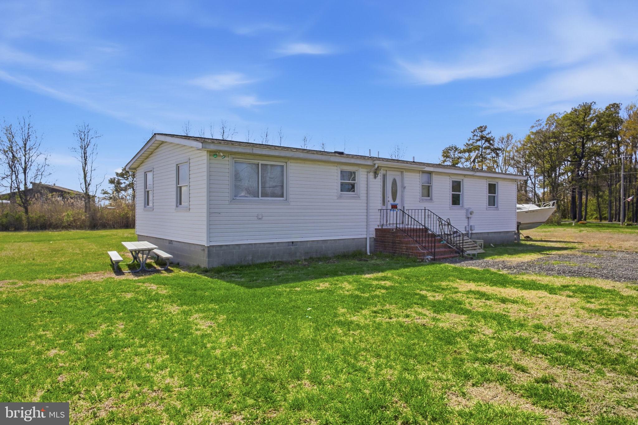 5666 Walnut Street Rock Hall, MD 21661 - Photo 1 of 18 a view of a house with a yard