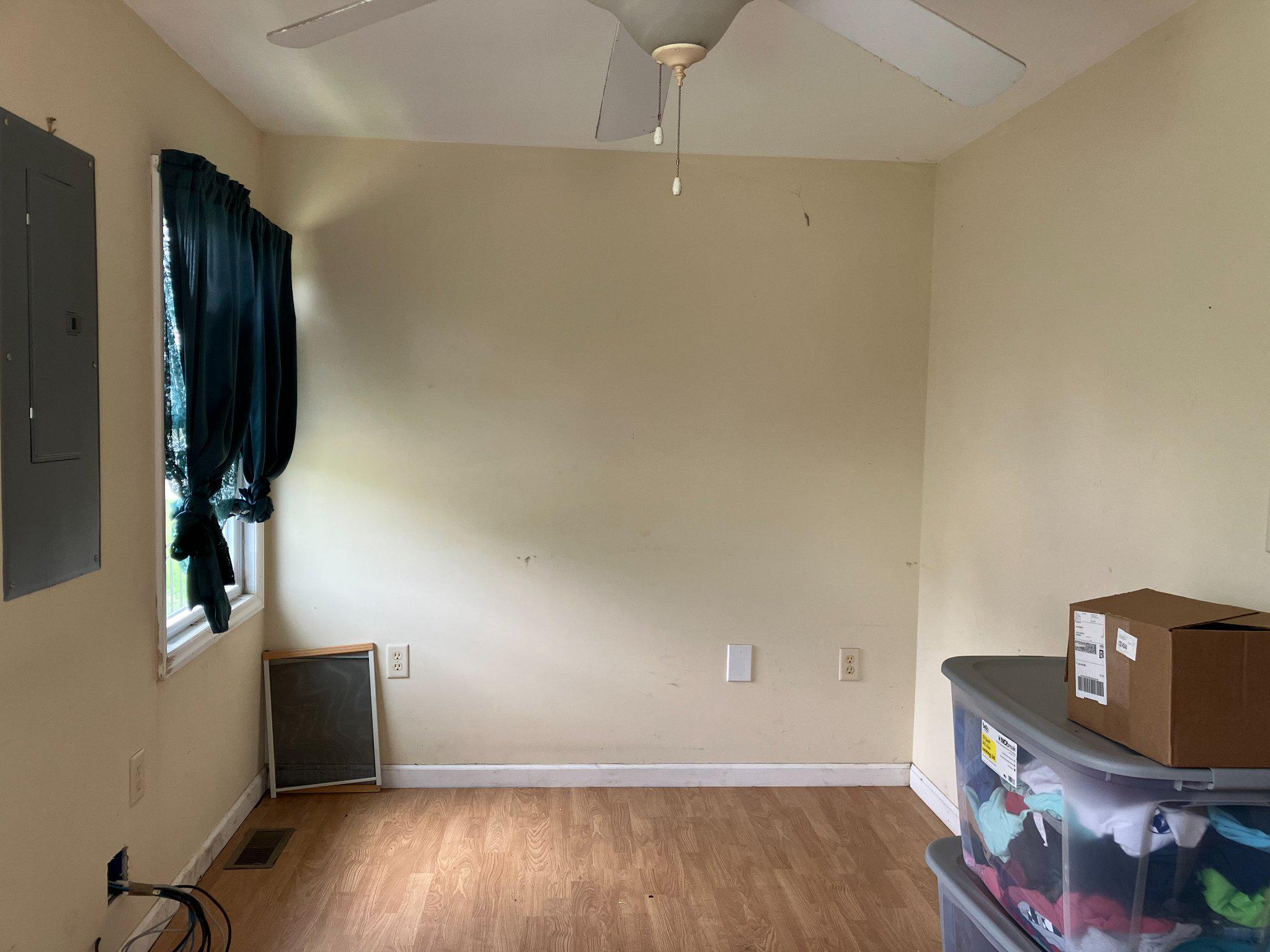 5666 Walnut Street Rock Hall, MD 21661 - Photo 12 of 18 an empty room with wooden floor and closet
