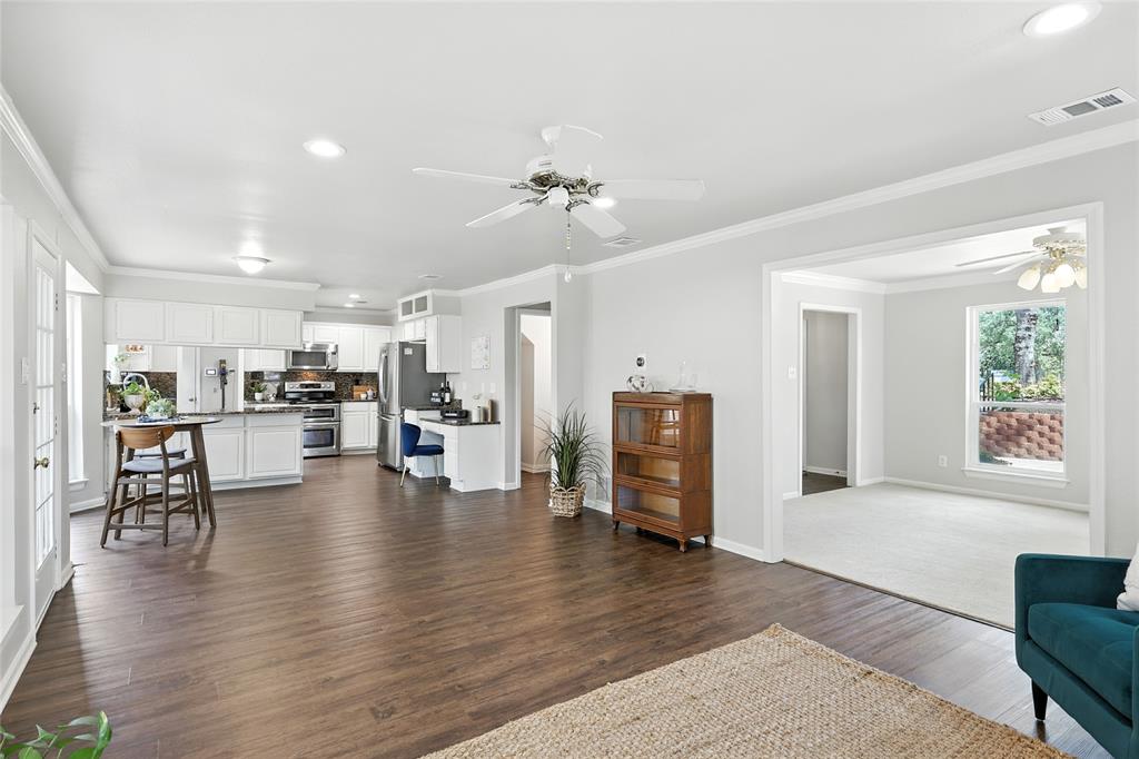 1330 Laredo Court Denton, TX 76205 - Photo 18 of 40 a living room with furniture and kitchen view