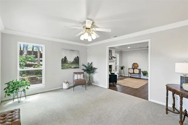 a view of a livingroom with furniture window and wooden floor