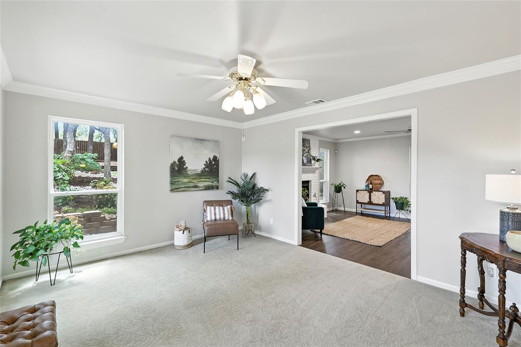 1330 Laredo Court Denton, TX 76205 - Photo 20 of 40 a view of a livingroom with furniture window and wooden floor