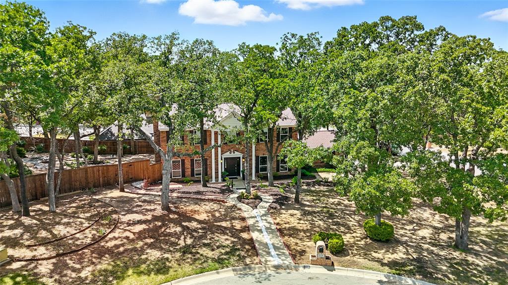 1330 Laredo Court Denton, TX 76205 - Photo 2 of 40 a front view of a house with a yard