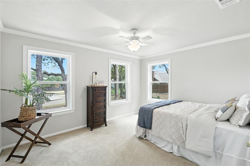 1330 Laredo Court Denton, TX 76205 - Photo 27 of 40 a bedroom with a bed and a window