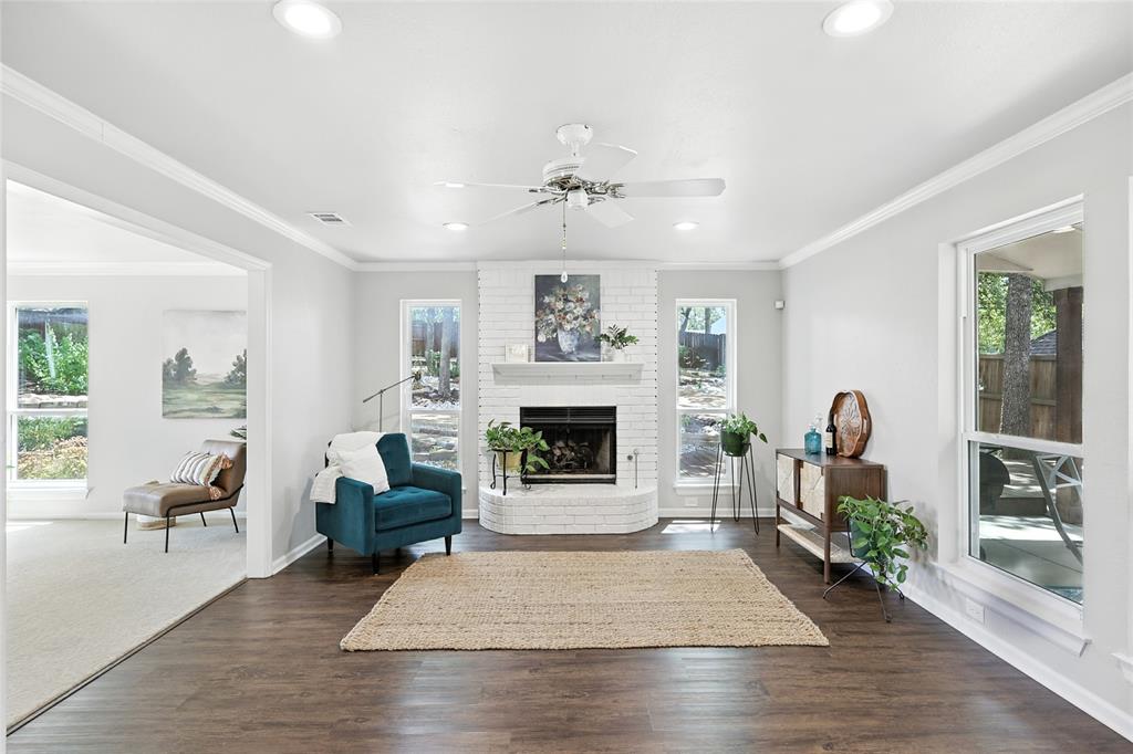 1330 Laredo Court Denton, TX 76205 - Photo 3 of 40 a living room with furniture and a fireplace