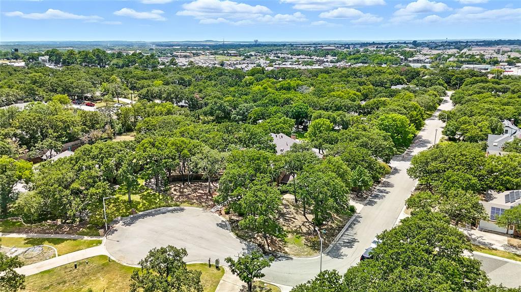 1330 Laredo Court Denton, TX 76205 - Photo 38 of 40 a view of a bunch of trees in a field