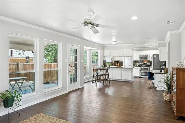 a view of a dining room with furniture window and wooden floor