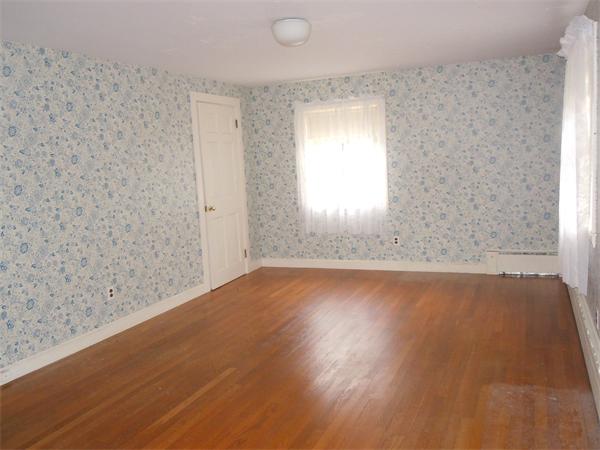 94 Bolton Road Harvard, MA 01451 - Photo 14 of 21 an empty room with wooden floor and windows
