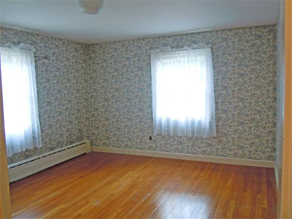 94 Bolton Road Harvard, MA 01451 - Photo 15 of 21 a view of empty room with wooden floor and fan