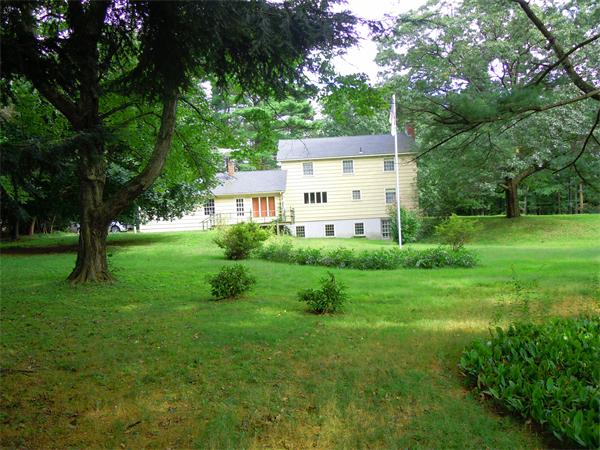 94 Bolton Road Harvard, MA 01451 - Photo 17 of 21 a view of a house with a big yard potted plants and large tree