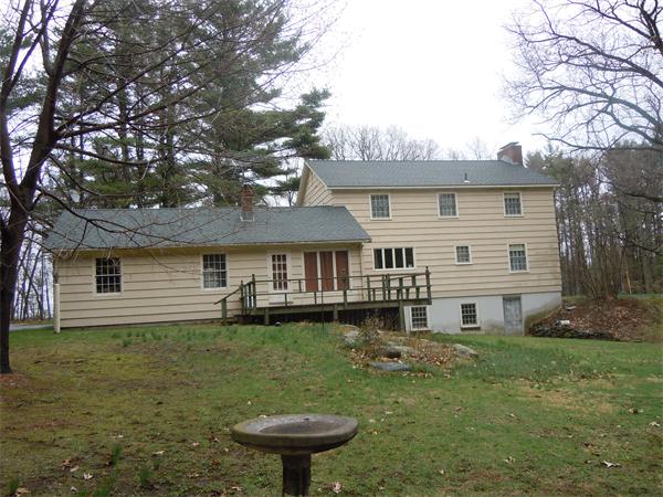 94 Bolton Road Harvard, MA 01451 - Photo 18 of 21 a front view of a house with garden