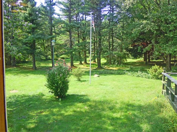 94 Bolton Road Harvard, MA 01451 - Photo 2 of 21 a backyard of a house with a yard and outdoor seating