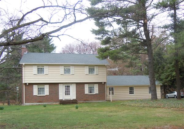 94 Bolton Road Harvard, MA 01451 - Photo 21 of 21 a front view of a house with a garden and yard