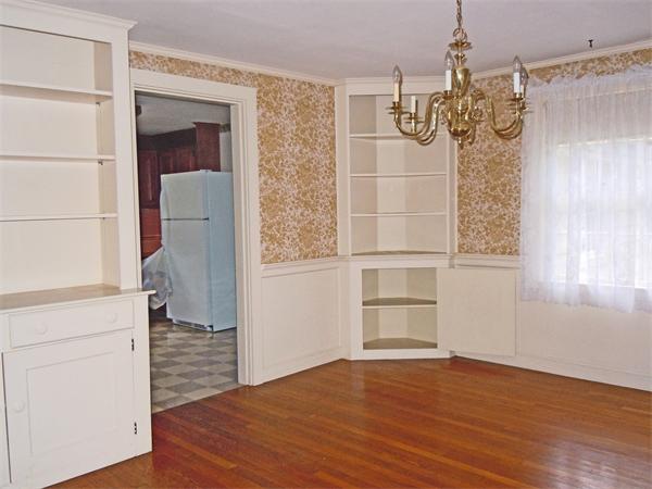 94 Bolton Road Harvard, MA 01451 - Photo 8 of 21 an empty room with wooden floor and cabinet