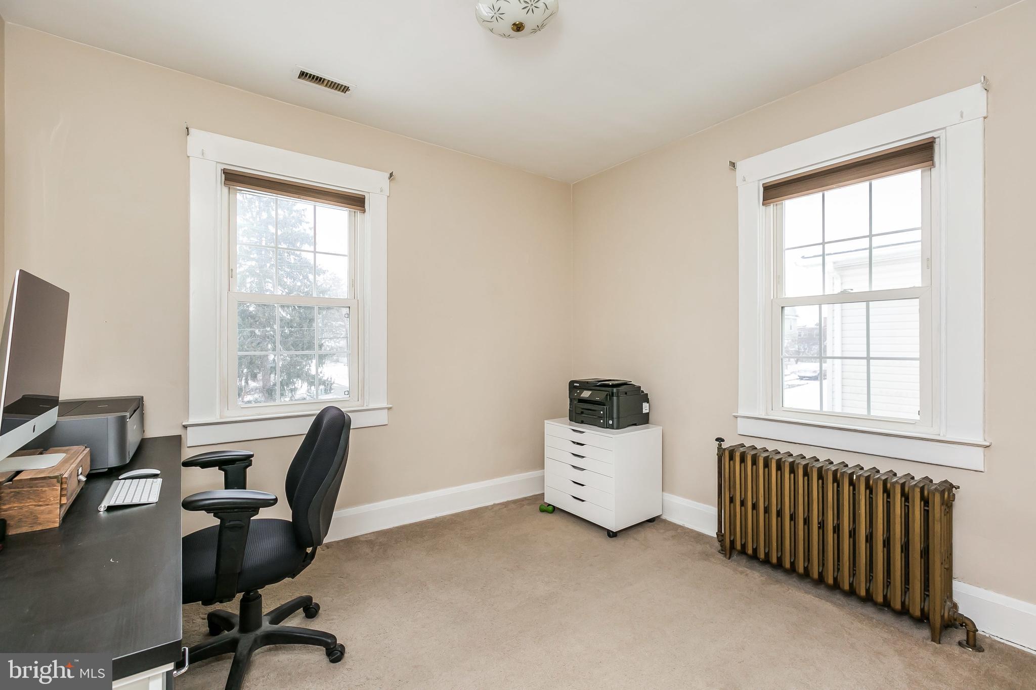 5804 Clearspring Road Baltimore, MD 21212 - Photo 22 of 32 a view of a workspace with furniture and a window
