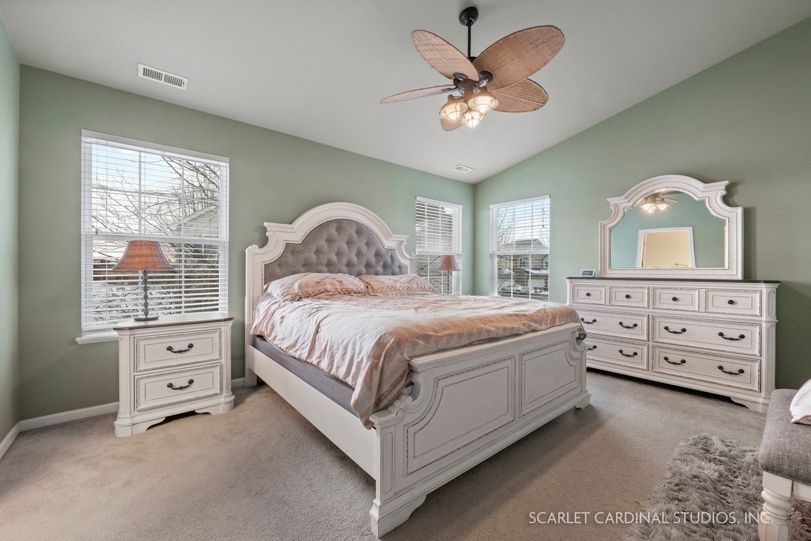 3739 Munson Street Plano, IL 60545 - Photo 12 of 21 a spacious bedroom with a bed a chandelier and a dresser