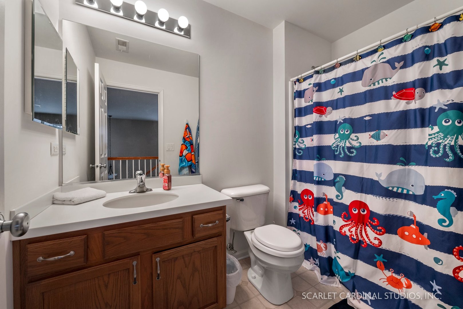 3739 Munson Street Plano, IL 60545 - Photo 15 of 21 a bathroom with a sink a toilet and a mirror
