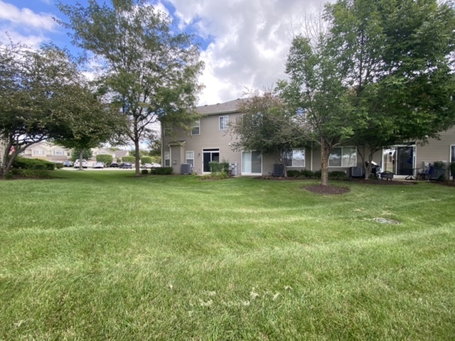 3739 Munson Street Plano, IL 60545 - Photo 18 of 21 a view of a tree in front of a house