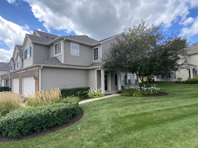 3739 Munson Street Plano, IL 60545 - Photo 2 of 21 a view of a house with a yard and plants