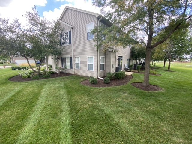 3739 Munson Street Plano, IL 60545 - Photo 21 of 21 a front view of house with yard and green space