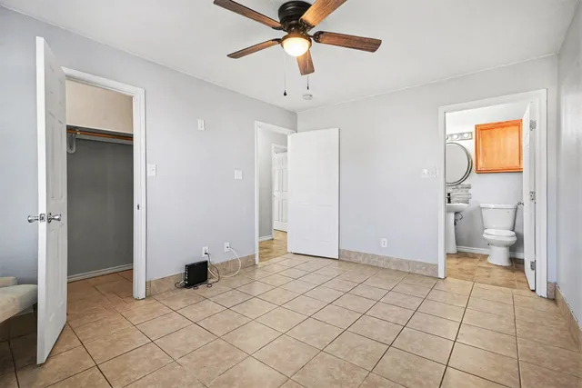 a view of an empty room and bathroom