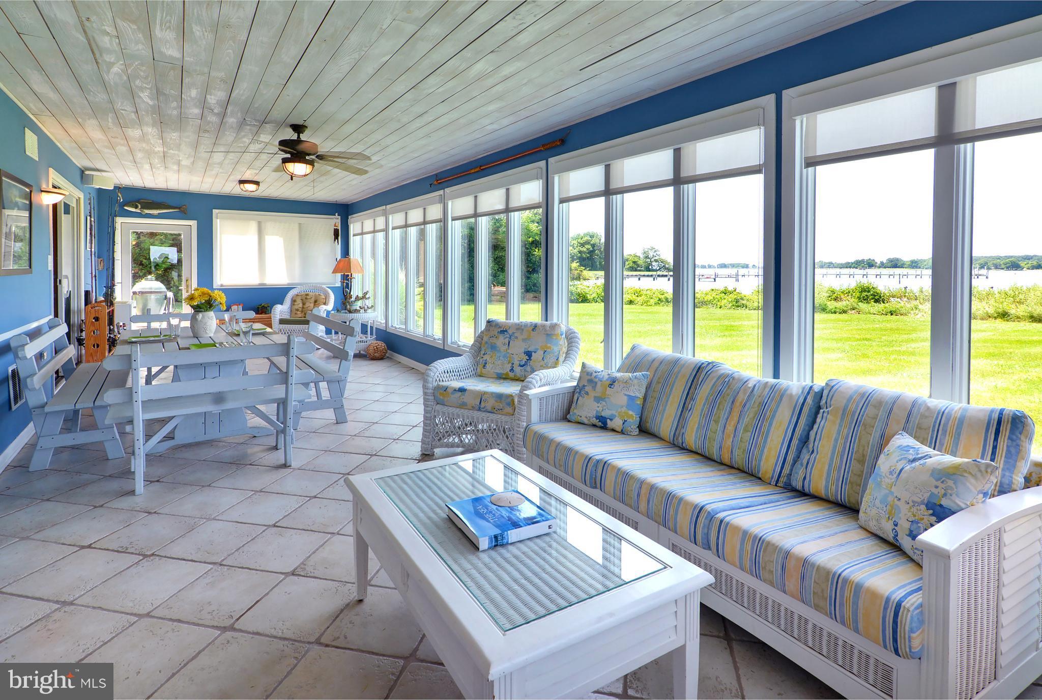 401 Old Point Road Chester, MD 21619 - Photo 20 of 28 a living room with furniture and a large window