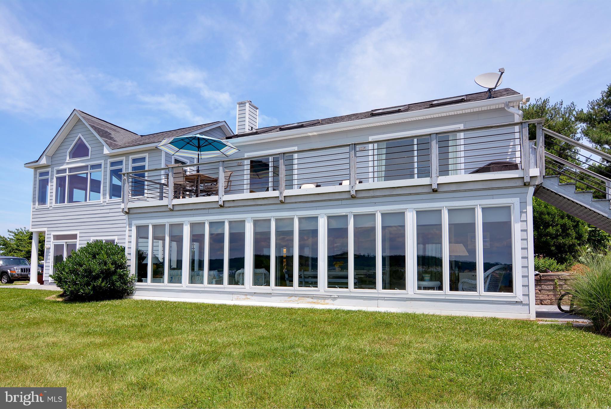 401 Old Point Road Chester, MD 21619 - Photo 3 of 28 a front view of a house with a yard