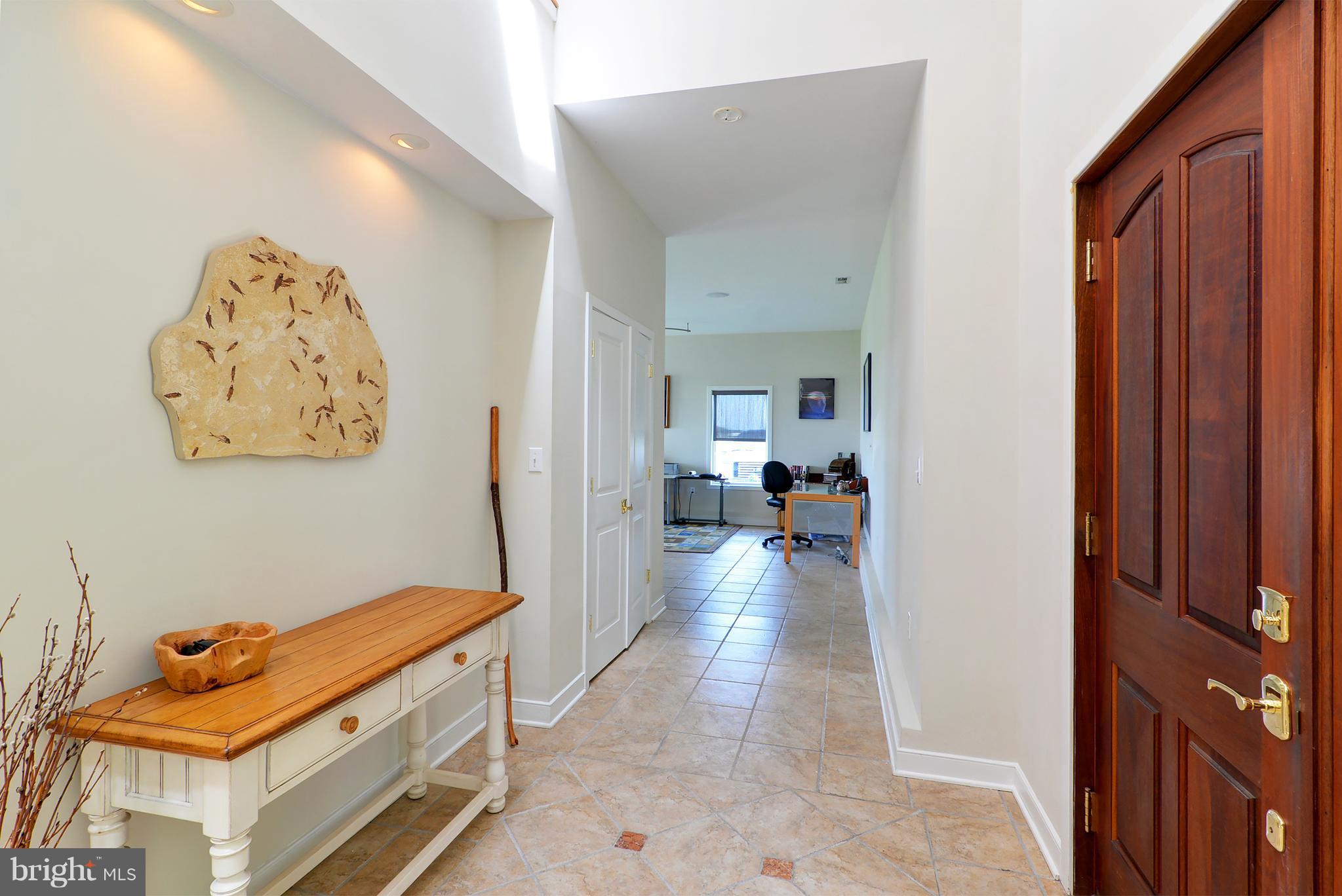 401 Old Point Road Chester, MD 21619 - Photo 21 of 28 a view of a hallway with workspace and a couch