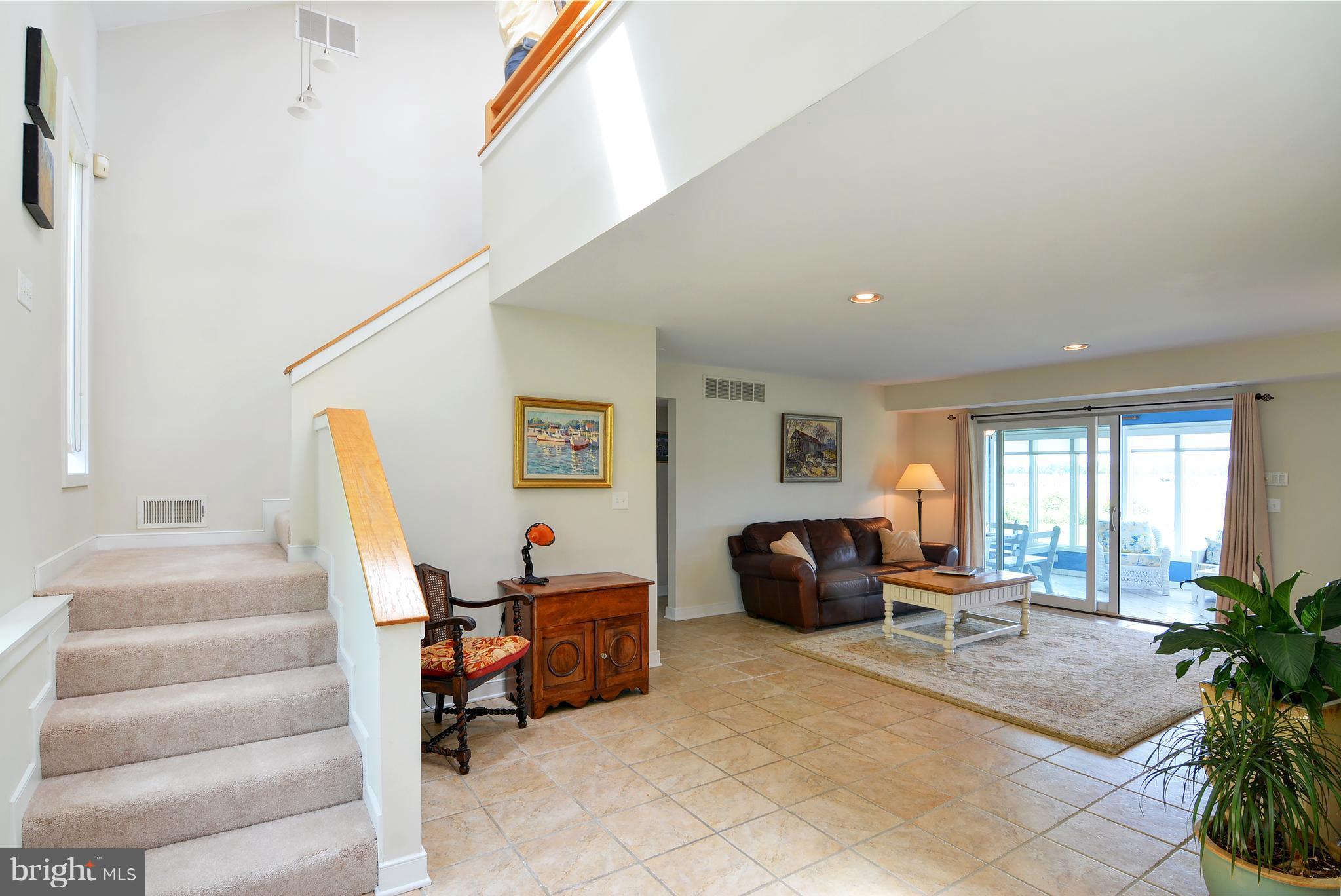 401 Old Point Road Chester, MD 21619 - Photo 22 of 28 a living room with furniture and a potted plant