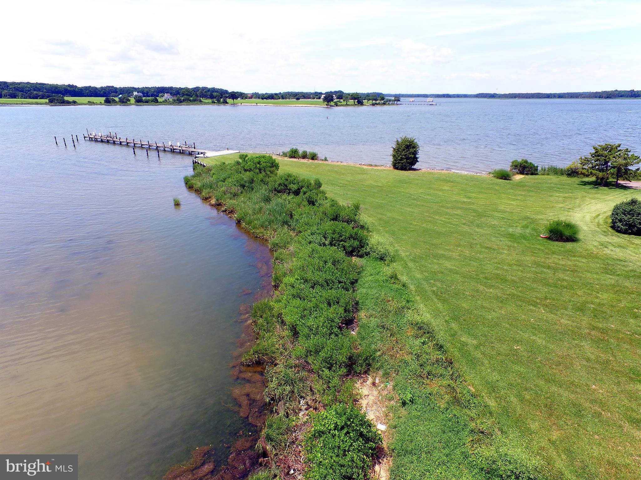 401 Old Point Road Chester, MD 21619 - Photo 6 of 28 a view of a lake with a building in the background