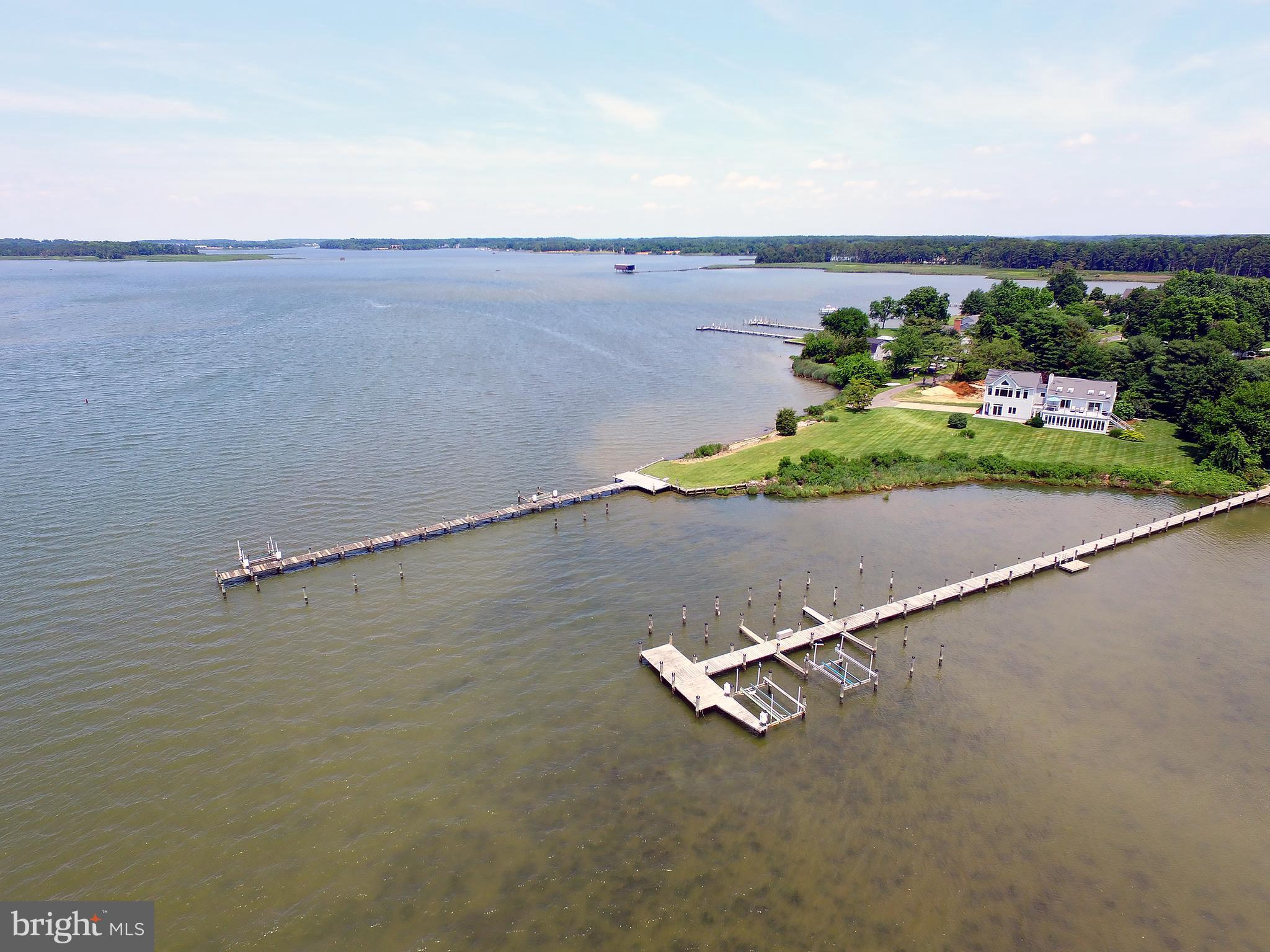 401 Old Point Road Chester, MD 21619 - Photo 7 of 28 an aerial view of a house with a yard and lake view