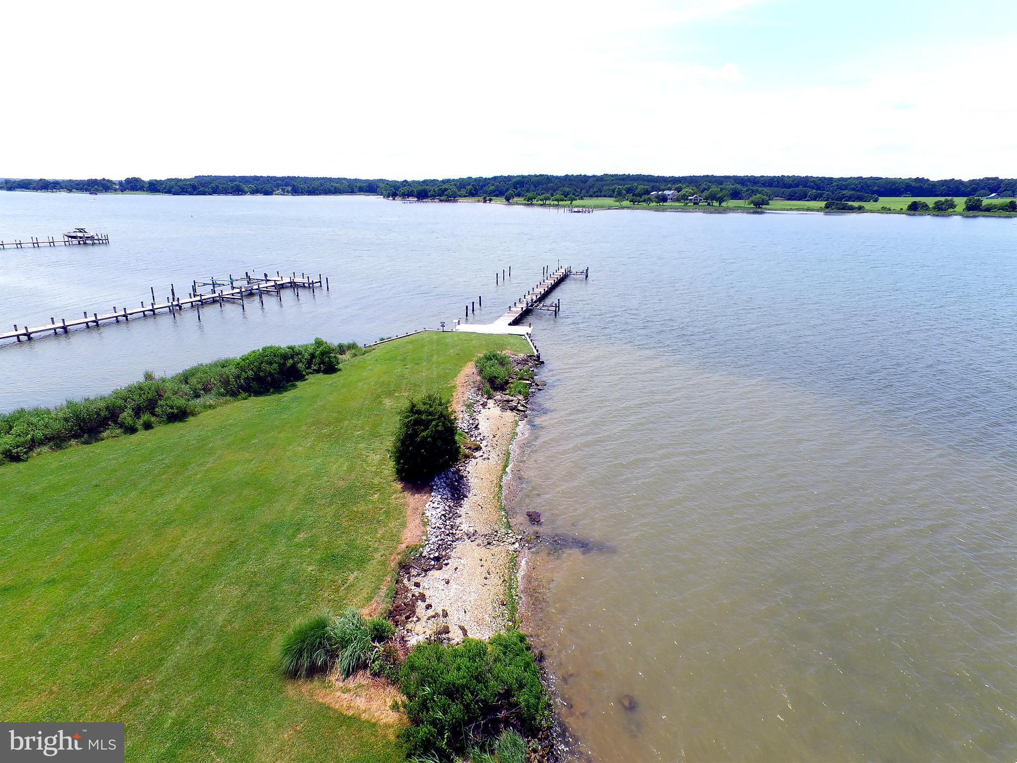 401 Old Point Road Chester, MD 21619 - Photo 8 of 28 a view of a lake with a field and lake view