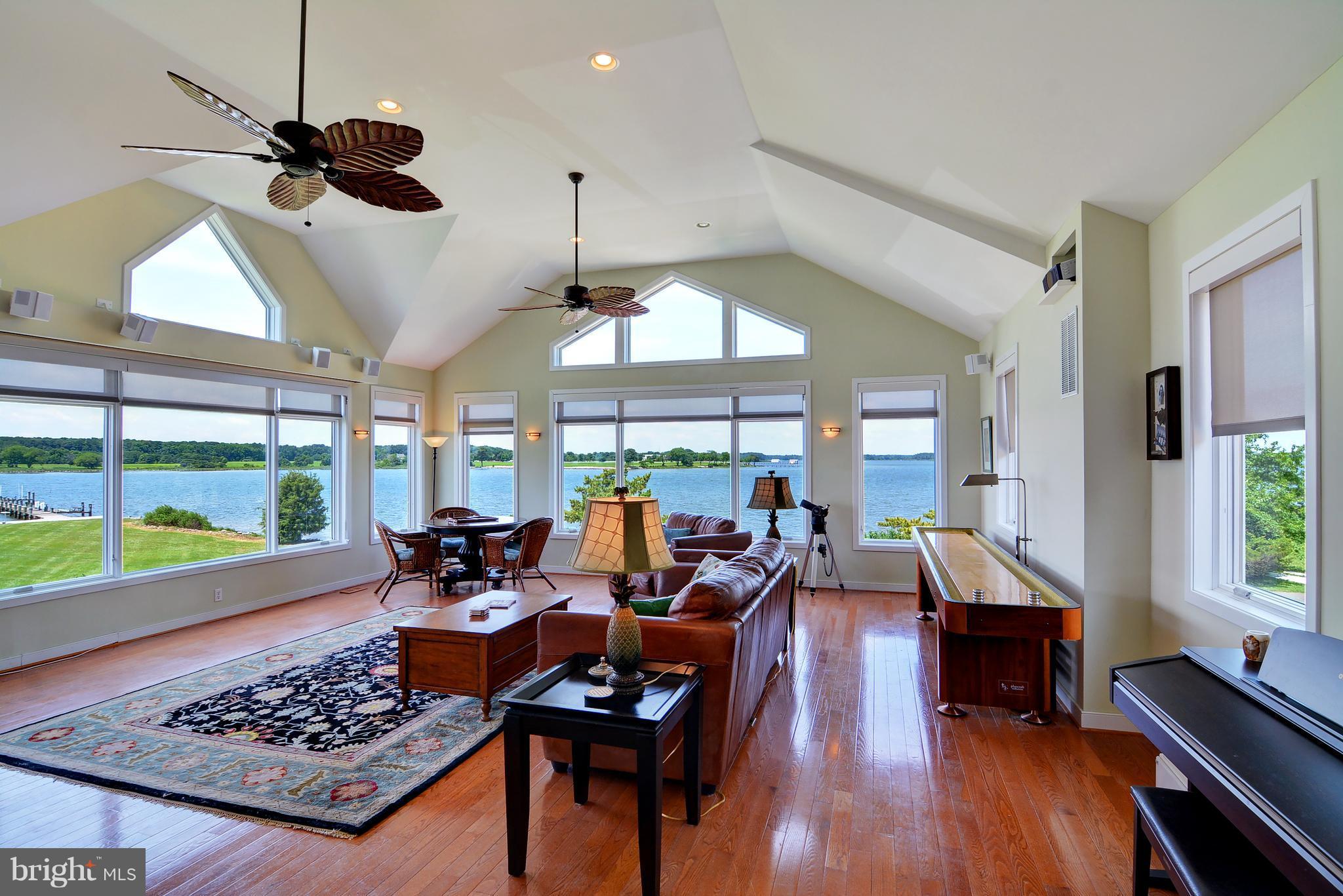 401 Old Point Road Chester, MD 21619 - Photo 10 of 28 a living room with furniture and a large window