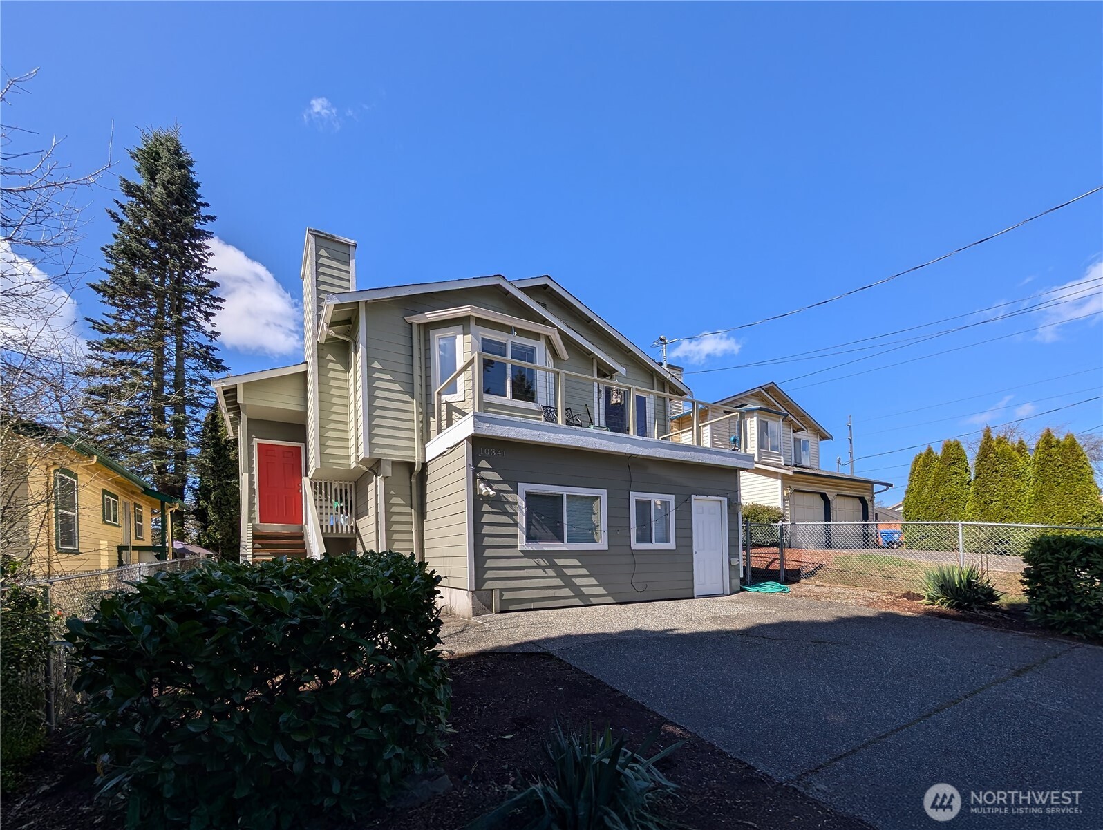 10341 Stone Avenue North Seattle, WA 98133 - Photo 1 of 18 a front view of a house with a yard