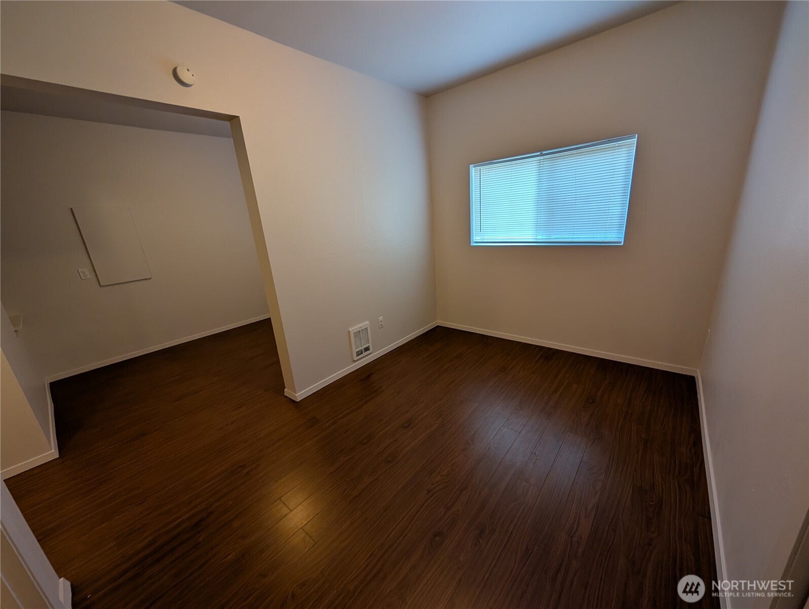 10341 Stone Avenue North Seattle, WA 98133 - Photo 13 of 18 a view of a livingroom with wooden floor and a flat screen tv