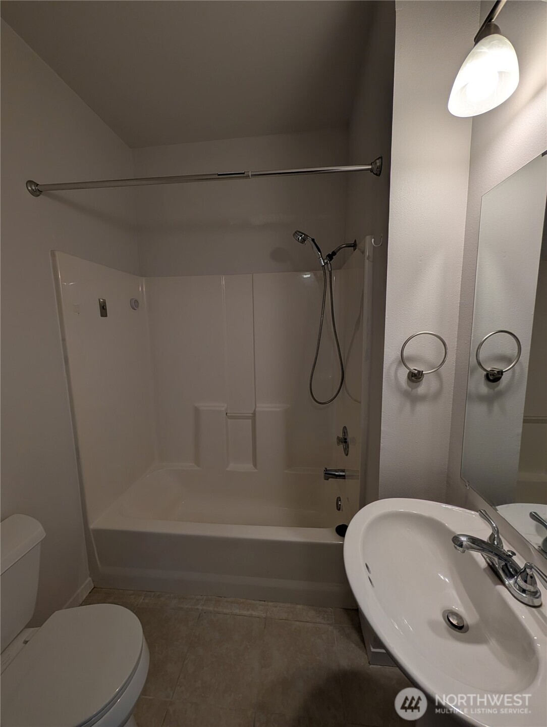 10341 Stone Avenue North Seattle, WA 98133 - Photo 15 of 18 a bathroom with a sink a toilet and shower