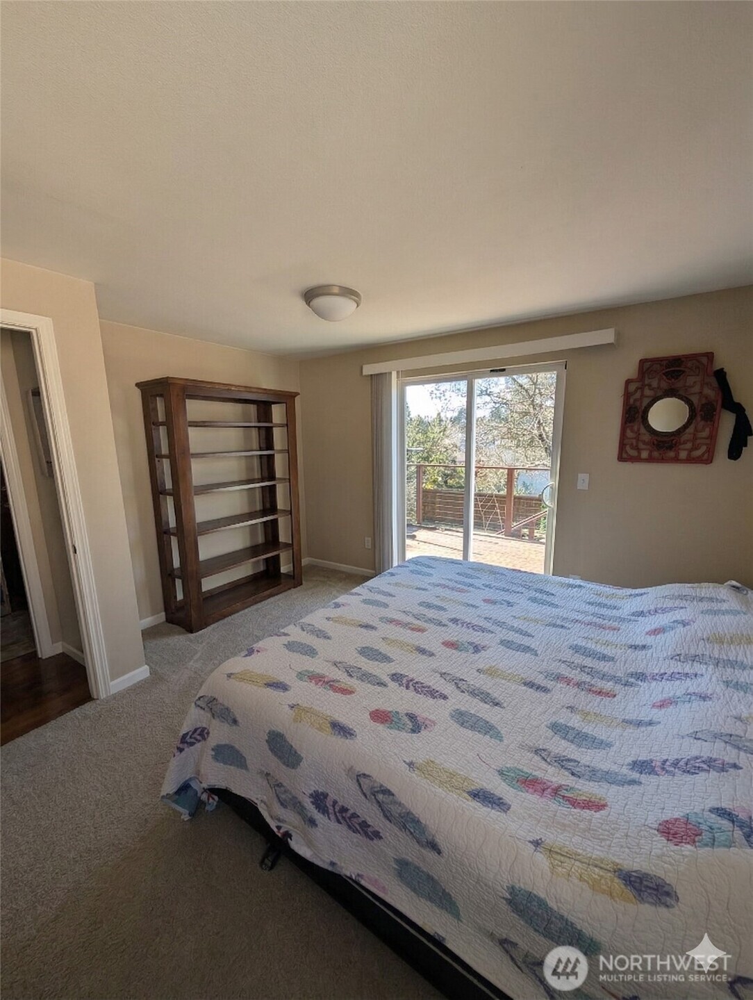 10341 Stone Avenue North Seattle, WA 98133 - Photo 3 of 18 a bedroom with a bed and a window