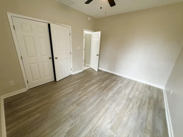 a bathroom with a sink a toilet and a shower