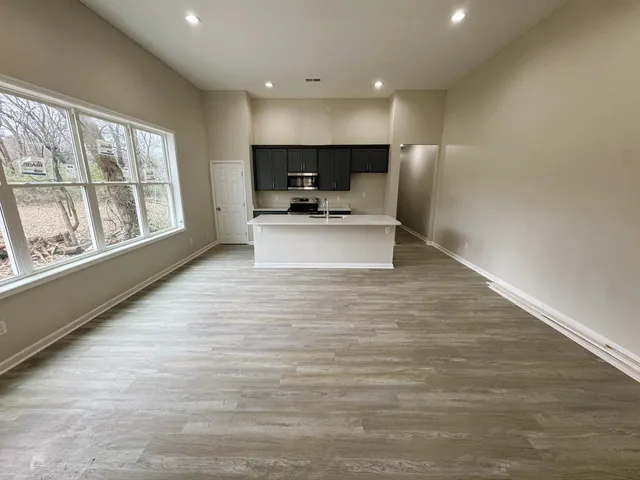 front view of a brick house with a large window