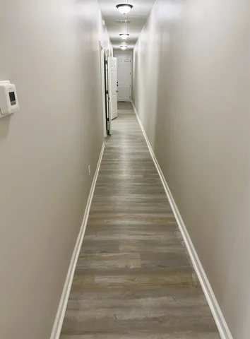 a bedroom with a bed a stove and a cabinets