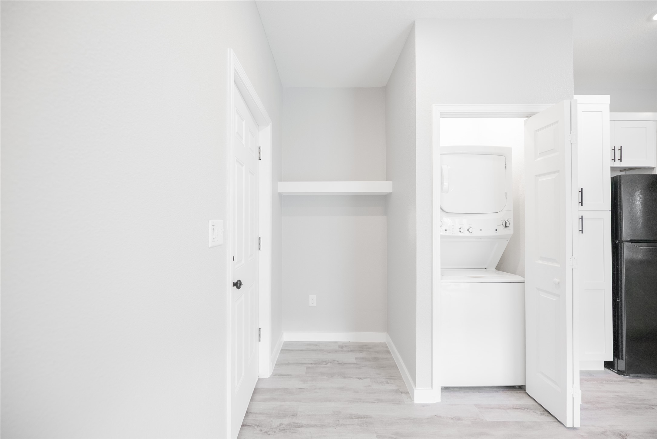 2101 Reinke Road, Unit 8301 Waller, TX 77484 - Photo 8 of 33 a view of a hallway with a white cabinet and a door