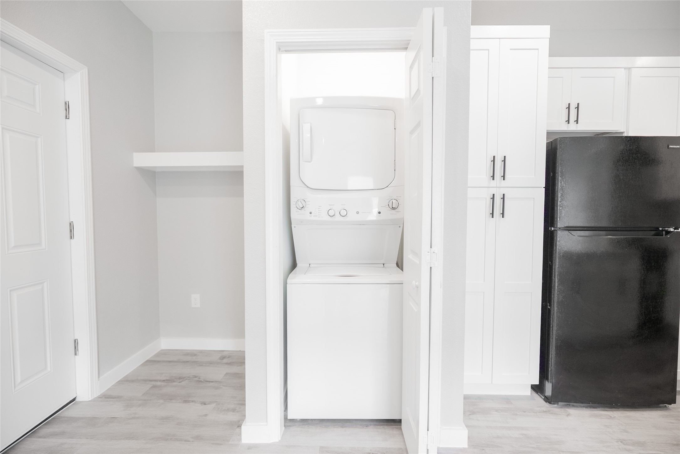 2101 Reinke Road, Unit 8301 Waller, TX 77484 - Photo 9 of 33 a kitchen with a refrigerator and cabinets